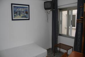 Cama o camas de una habitación en Hostal Mengual