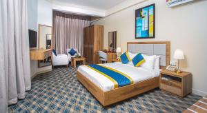 Postel nebo postele na pokoji v ubytování La Villa Palace Hotel