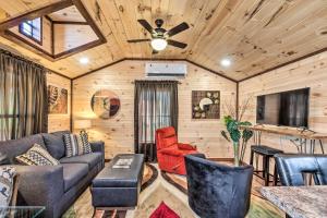 a living room with a couch and a ceiling fan at Somerset Cabin, Close to Lake Access! in Somerset
