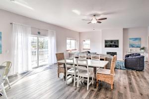 a dining room and living room with a table and chairs at Dog-Friendly Canalfront Condo in Ocean Shores in Ocean Shores