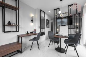 a dining room with a table and chairs at Hermes Suites, Agia Sofia, Nilie Hospitality MGMT in Thessaloniki +44 photos