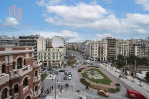 a city with a street with cars and buildings at Hermes Suites, Agia Sofia, Nilie Hospitality MGMT in Thessaloniki