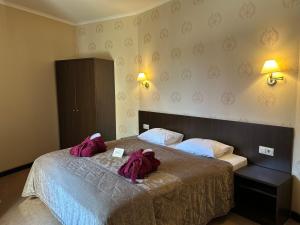 Postel nebo postele na pokoji v ubytování Romantik Spa Hotel