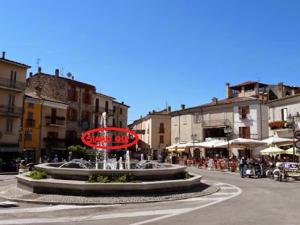 a large fountain in the middle of a city street at B&B BuongiornoNotte in Bobbio