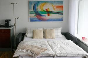 Кровать или кровати в номере Traumblick auf‘s Meer