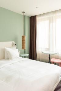 Un ou plusieurs lits dans un hébergement de l'établissement Conscious Hotel Vondelpark