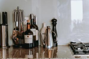 a group of bottles of wine sitting on a counter at Villas Elini in Perdika