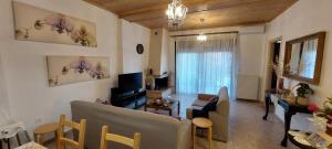 A television and/or entertainment centre at To Spitaki