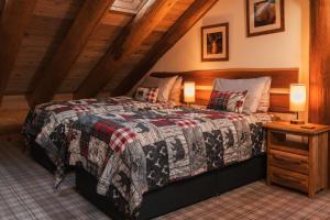 a bedroom with a bed in a attic at Caledonian Cabin in Invergarry