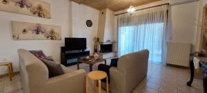A television and/or entertainment centre at To Spitaki