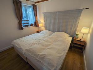 Postel nebo postele na pokoji v ubytování Fachwerkhaus Hartmann