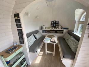 an overhead view of a tiny house with a table at The Pilchard - Lydcott Glamping Cornwall, sea view in East Looe