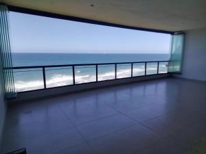 a large balcony with a view of the ocean at 504 Coral Reef in La Mercy