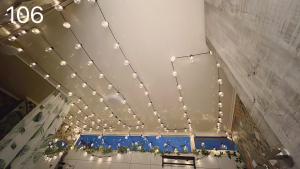 a bunch of lights on the ceiling of a room at Wind Natural Parent-Child Inn II in Houli