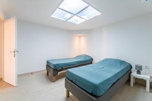 Posteľ alebo postele v izbe v ubytovaní Bas de villa refait à neuf, climatisation et terrasse vue mer