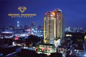 a view of a city skyline at night at Grand Diamond Suites Hotel in Bangkok