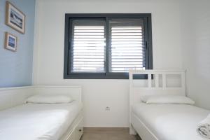 Postel nebo postele na pokoji v ubytování Chill in paradise
