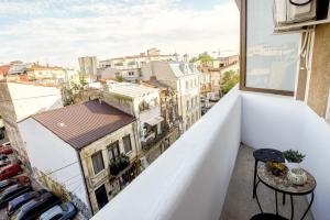 a balcony with a view of a city at Metropole Apartments Old Town in Bucharest