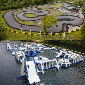 an aerial view of a water park with many slides at The Pilchard - Lydcott Glamping Cornwall, sea view in East Looe