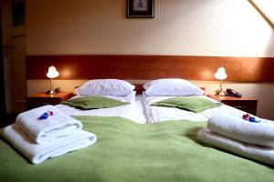 Łóżko lub łóżka w pokoju w obiekcie Motel Arkadia