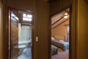a room with a bathroom with a bed and a toilet at StDenis Townhouse Maisonette in the City Center with Exceptional Hospitality By Villa Mana Gers in Zakynthos Town +14 photos