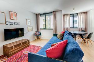 a living room filled with furniture and a fire place at Lisbon Serviced Apartments - Liberdade in Lisbon