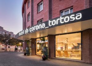 a store with a sign that says that corona tortosa at Apartaments SB Corona Tortosa in Tortosa