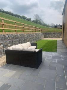 a couch sitting on top of a patio at 3 bedroom barn conversion in the country (Pet Friendly) in Stawell