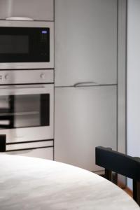 A kitchen or kitchenette at BasicVillage Milano