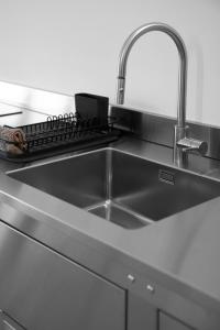 A kitchen or kitchenette at BasicVillage Milano