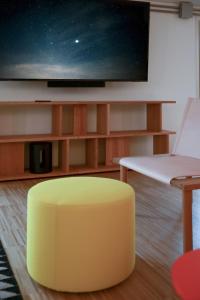 A television and/or entertainment centre at BasicVillage Milano