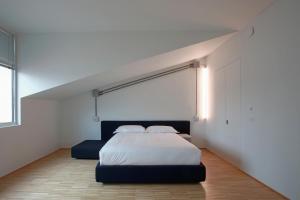 A bed or beds in a room at BasicVillage Milano