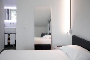 A bed or beds in a room at BasicVillage Milano