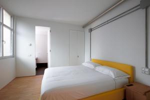 A bed or beds in a room at BasicVillage Milano