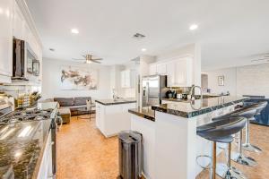 a kitchen with white cabinets and a counter top at Indio Diamond in Indio