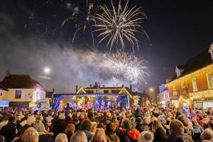a large crowd of people watching a fireworks show at Stone Cottage in Thornage