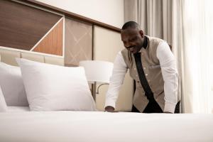 Three Pearls Musalli Hotel客房内的一张或多张床位