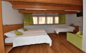 Postel nebo postele na pokoji v ubytování Agritur Anselmi