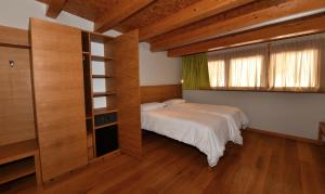 Postel nebo postele na pokoji v ubytování Agritur Anselmi
