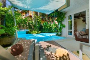 a swimming pool in a house with plants at 3 BR Pool Villa - Kids Paradise in a beachside resort in Choeng Mon Beach