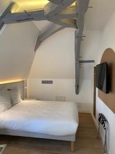 Postel nebo postele na pokoji v ubytování La Clef des Châteaux