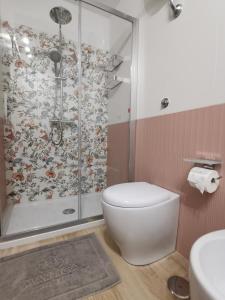 a bathroom with a shower and a toilet and a sink at Casa Marinella in Crotone