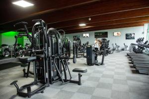 a gym with a bunch of treadms and machines at Flat 2, The Old Antiques Warehouse - FREE off-site Health Club access with Pool, Sauna, Steam Room & Gym in Bowness-on-Windermere
