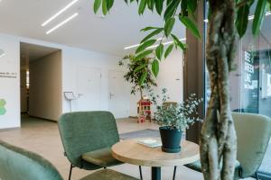 Predel za sedenje v nastanitvi BEE GREEN Linz Self-Check-in-Hotel