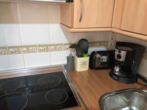 A kitchen or kitchenette at Apartamento Espata I