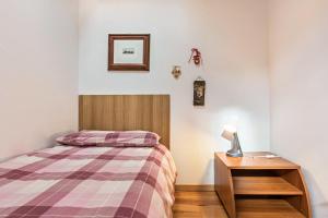 Postel nebo postele na pokoji v ubytování Casa Lidia Luxury attico 7
