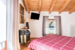 Postel nebo postele na pokoji v ubytování Casa Lidia Luxury attico 7