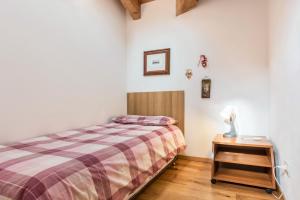 Postel nebo postele na pokoji v ubytování Casa Lidia Luxury attico 7