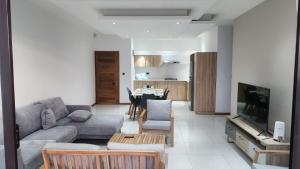 a living room with a couch and a table at SEAVIEW LUXURY APPARTMENT in Flic-en-Flac +24 photos