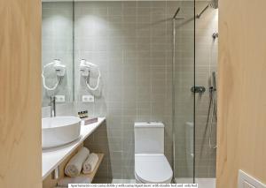 a bathroom with a toilet and a sink and a shower at Gòtic by The 5ve Soul in Barcelona